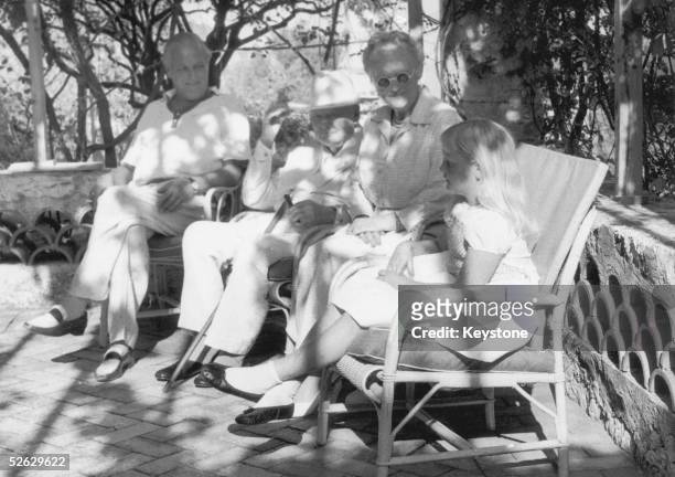 British statesman Winston Churchill and Lady Clementine Churchill , celebrating their golden wedding at Cap d'Ail, Nice, France. With them is their...