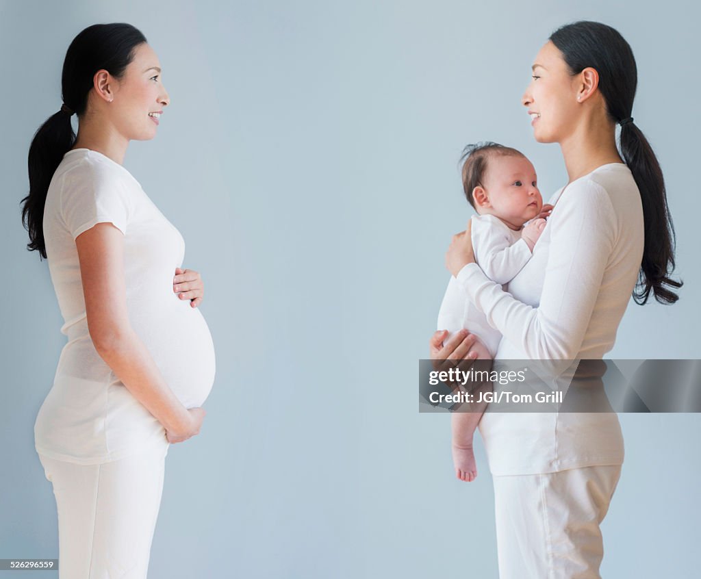 Double exposure of pregnant Asian mother before and after birth of baby