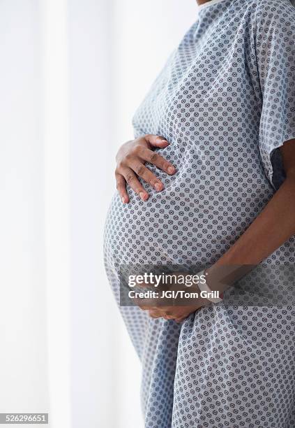Pregnant African American Mother Holding Her Belly In Hospital High-Res Stock Photo
