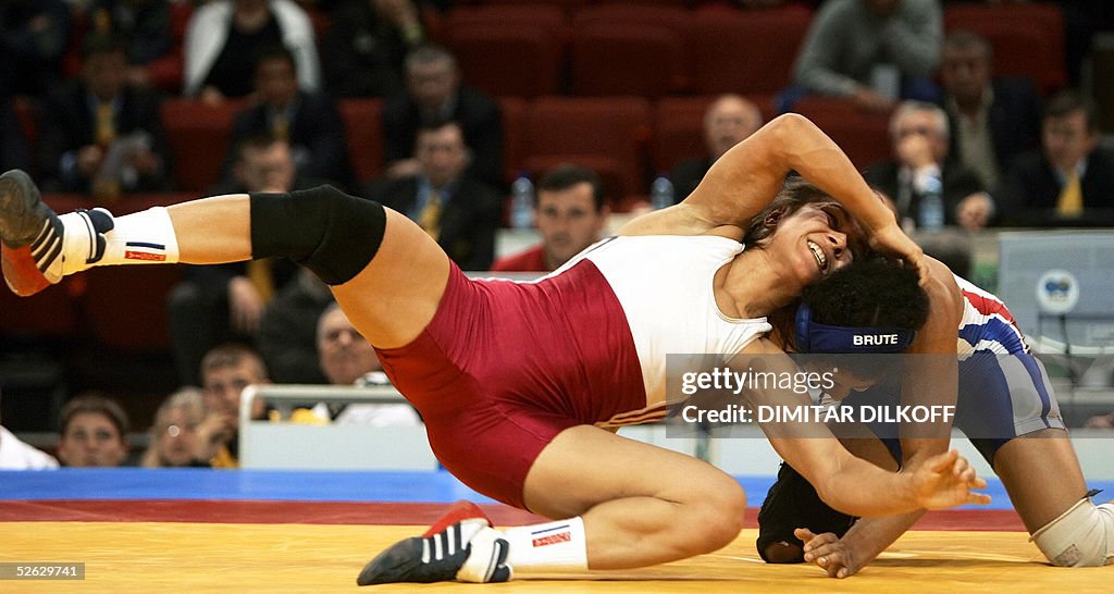 Natalia Golts of Russia wrestles Anna Gomis of France during their