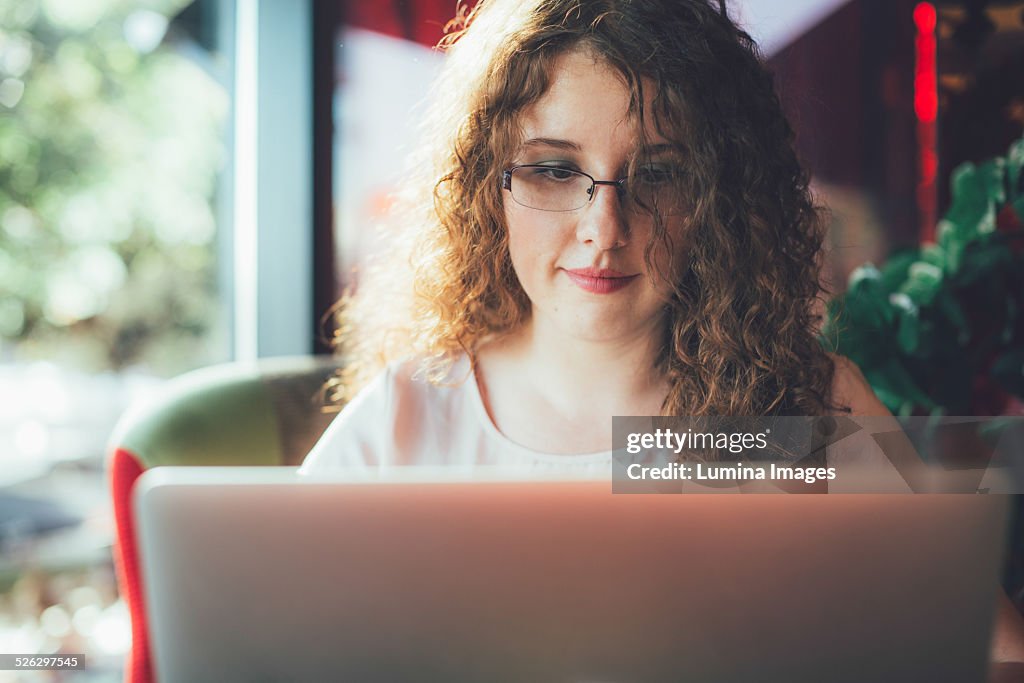 Woman using laptop computer