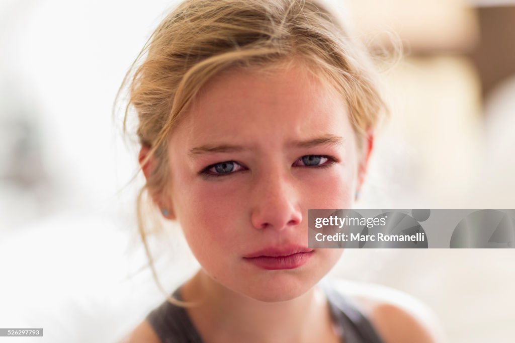 Close up of red face of crying Caucasian girl