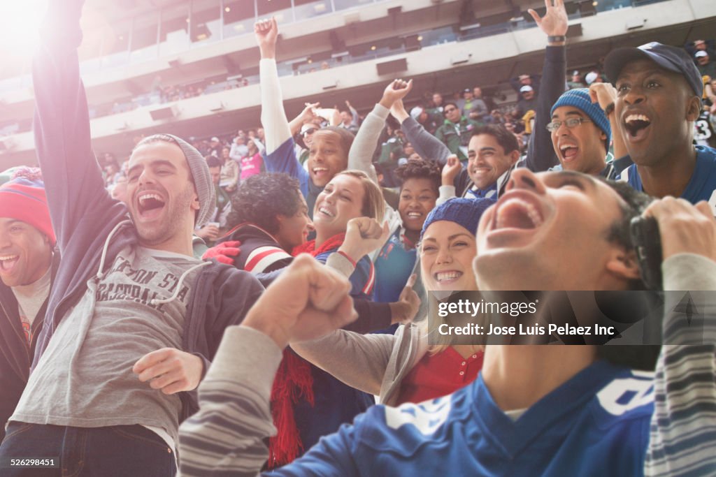 Fans cheering at American football game