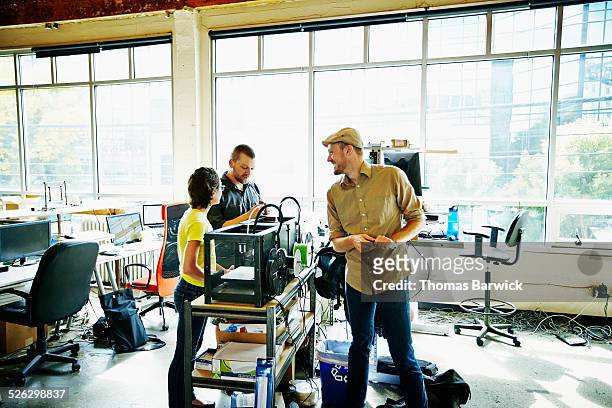 engineers watching prototype build on 3d printer - shirt mockup stock pictures, royalty-free photos & images