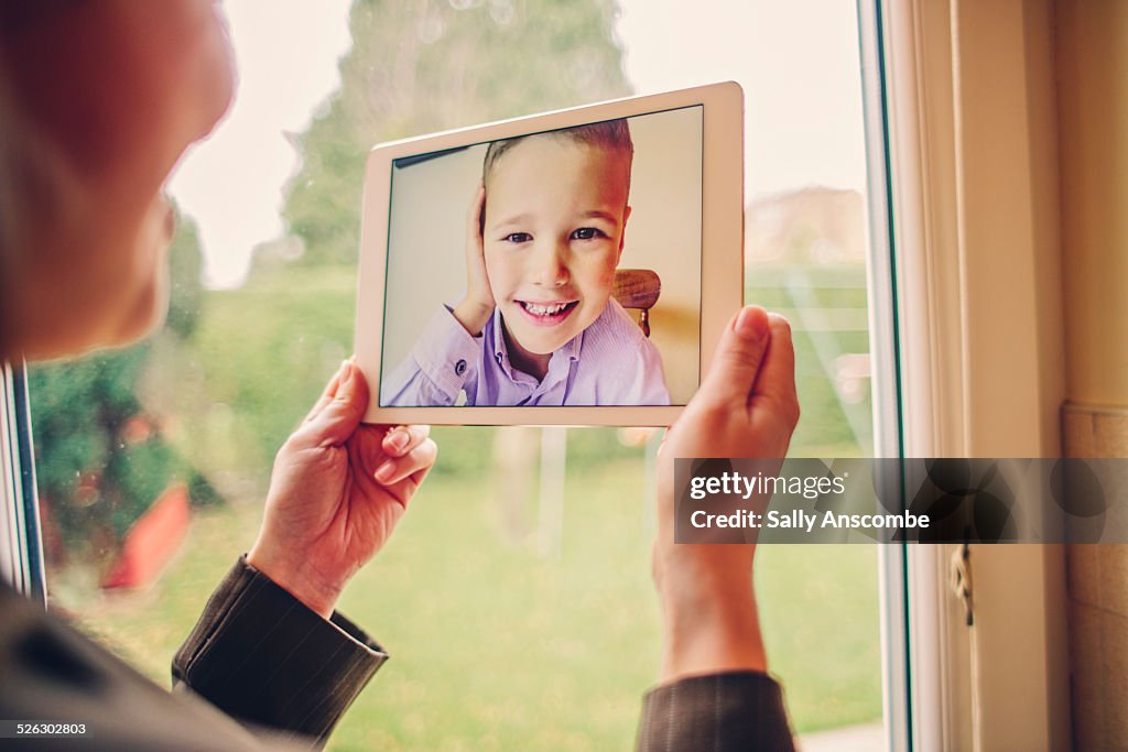 Mother and child talking over the internet