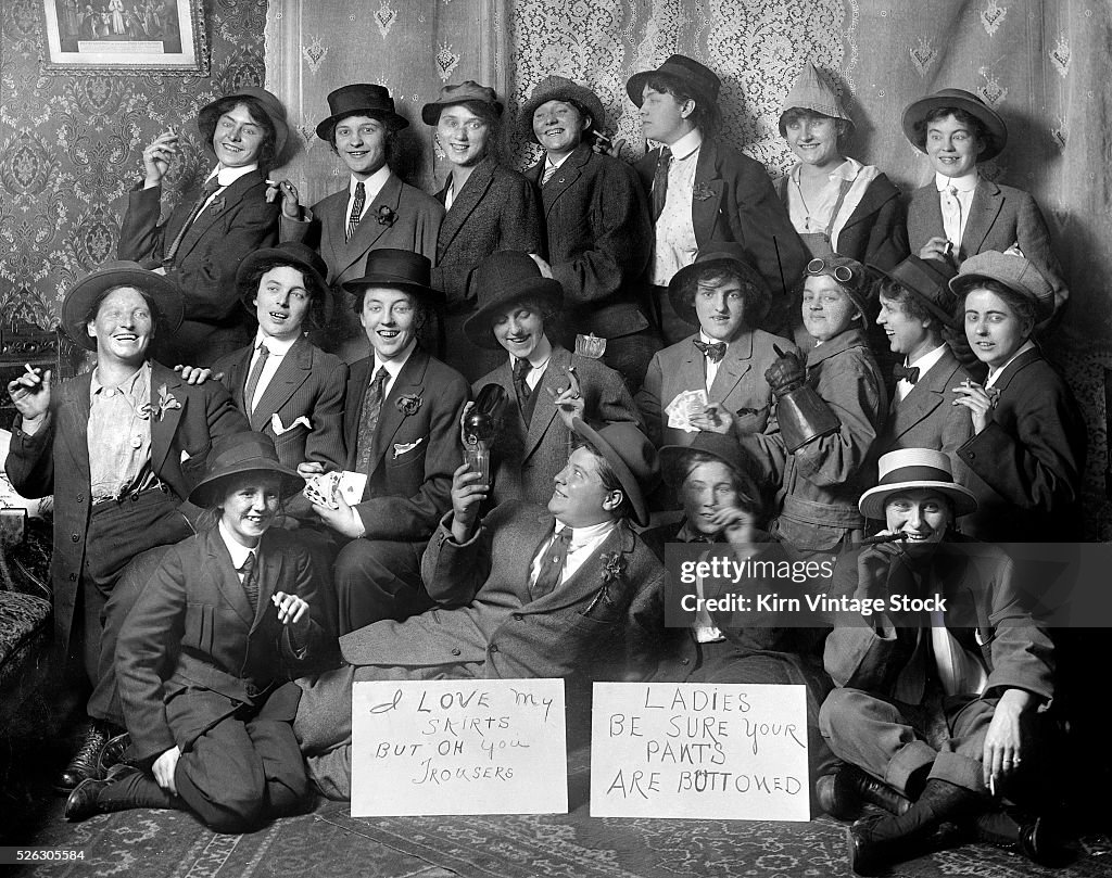 Crossing dressing women pose for group picture, ca. 1920.