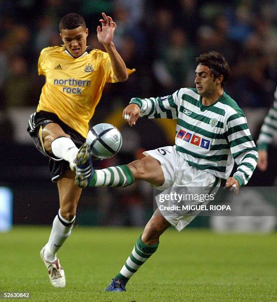 Sporting Lisbon's player Carlos Martins vies with Newcastle's Jermaine Jenas during their quarter final second leg Uefa Cup football match at Jose...