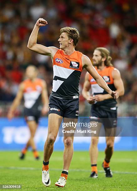 Lachie Whitfield of the Giants celebrates a goal during the round six AFL match between the Greater Western Sydney Giants and the Hawthorn Hawks at...