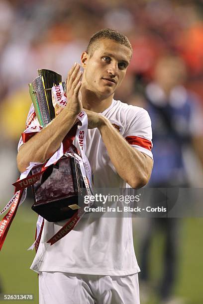 Manchester United Captain Nemanja Vidic holds the trophy after the World Football Challenge Friendly match between FC Barcelona and Manchester...