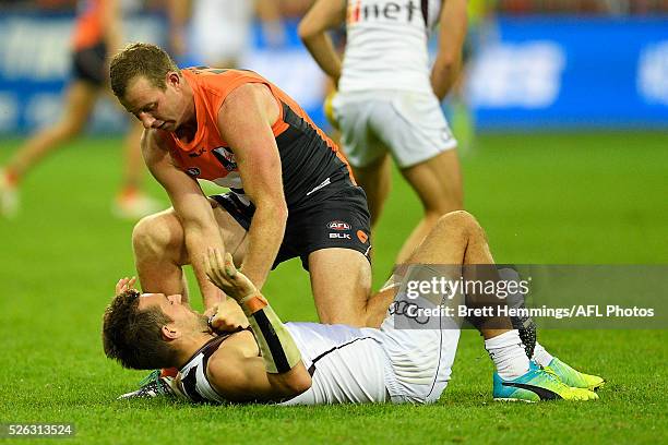 Steve Johnson of the Giants and Luke Hodge of the Hawks wrestle during the round six AFL match between the Greater Western Sydney Giants and the...