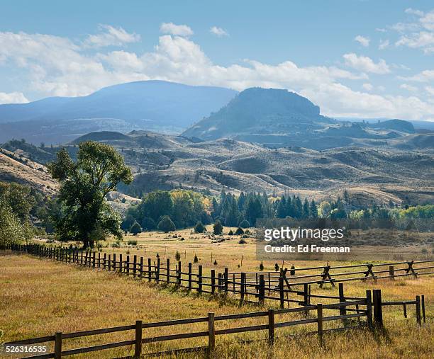 western ranch, fences and mountains - montana stock-fotos und bilder