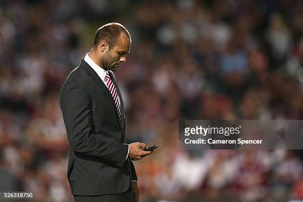 Brett Stewart of the Sea Eagles watches team mates warm up prior to the round nine NRL match between the Manly Sea Eagles and the North Queensland...