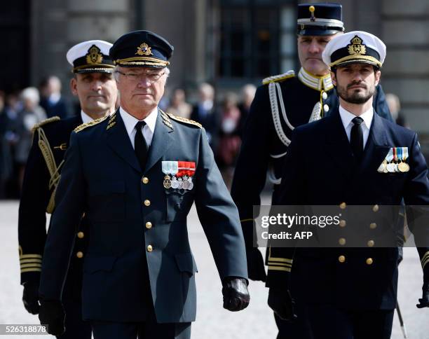 King Carl XVI Gustaf and Prince Carl Philip arrive on the outer courtyard at the Royal Palace in Stockholm, Sweden, for the Kings 70th birthday...