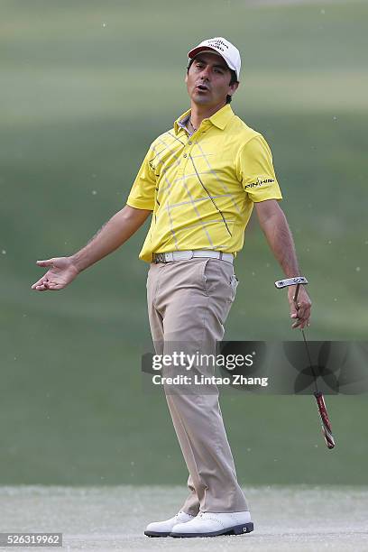 Felipe Aguilar of Chile reacts after the plays a shot during the third round of the Volvo China open at Topwin Golf and Country Club on April 30,...