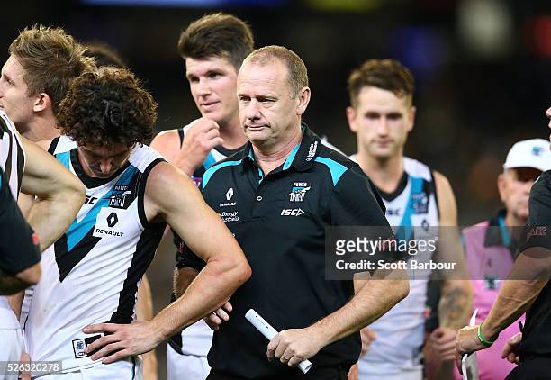 Ken Hinkley, coach of the Power speaks to his team during a quarter time break during the round six AFL match between the Richmond Tigers and the...