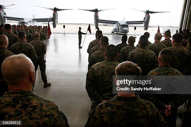 Marines from the 3rd Marine Aircraft wing stand in formation next to a V-22 Osprey during a ceremony on Friday, February 18, 2011 at MCAS Miramar...