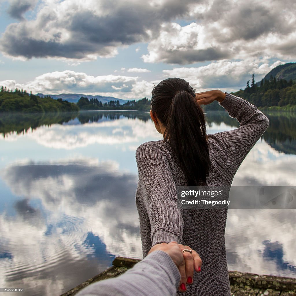 Man and woman by lake