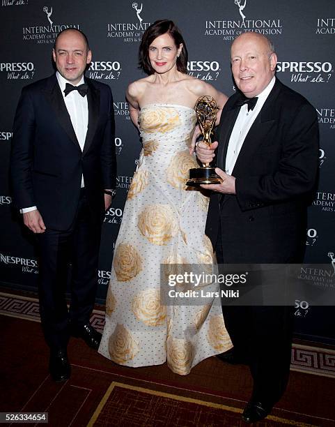 Gareth Neame, Elizabeth McGovern and Julian Fellowes attend the "43rd International Emmy Awards" at the New York Hilton in New York City. �� LAN