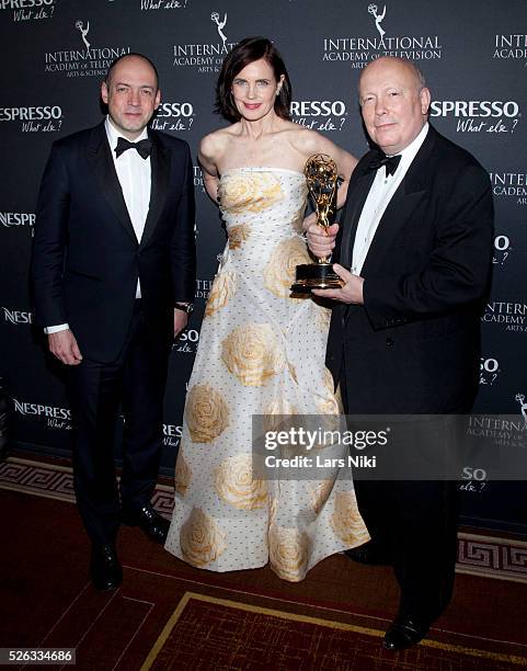 Gareth Neame, Elizabeth McGovern and Julian Fellowes attend the "43rd International Emmy Awards" at the New York Hilton in New York City. �� LAN