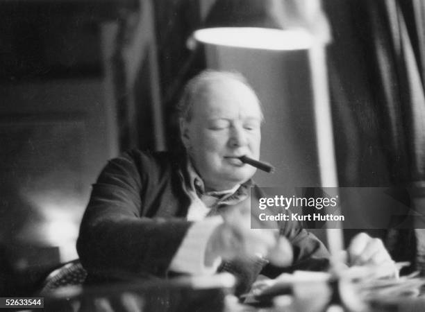 British statesman Winston Churchill , at his writing desk at home at Chartwell in Kent, 25th february 1939. Original publication: Picture Post - 90 -...