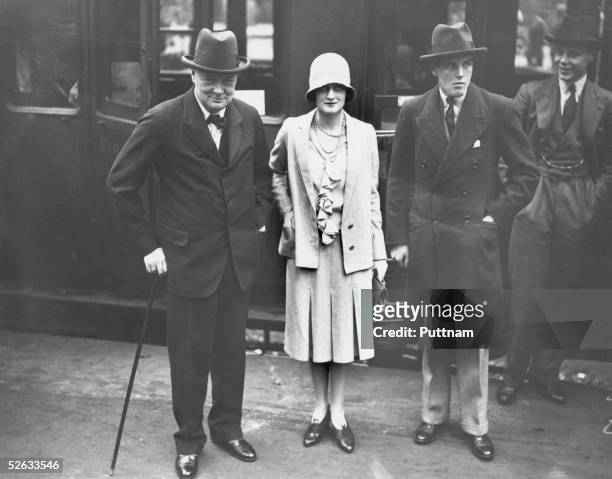 British statesman Winston Churchill at Waterloo Station, London, at the start of a trip to canada with his son Randolph , 3rd August 1929. Seeing...