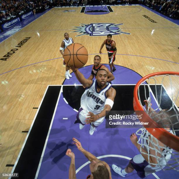 Kenny Thomas of the Sacramento Kings drives to the basket against the Portland Trail Blazers at Arco Arena on March 22, 2005 in Sacramento,...