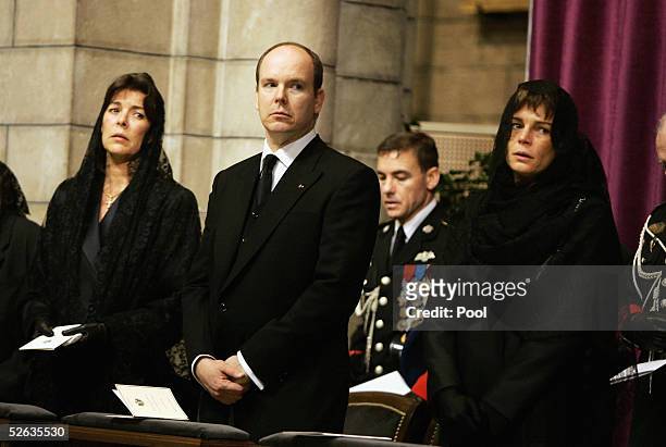 Princess Caroline of Hanover, Prince Albert of Monaco and Princess Stephanie of Monaco are seen inside the Cathedral at the funeral service of...
