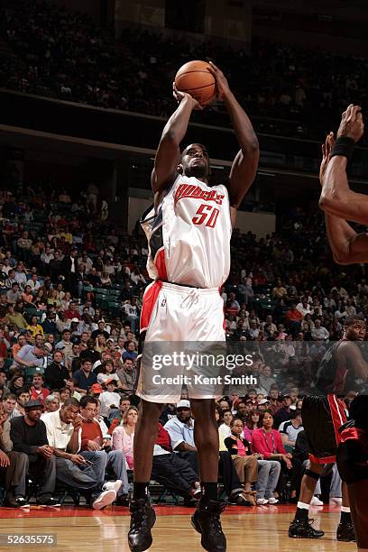 Emeka Okafor#50 of the Charlotte Bobcats shoots a jump shot to the basket against the Miami Heat at Charlotte Coliseum on March 26, 2005 in...