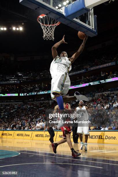 Smith of the New Orleans Hornets takes the ball to the basket during the game against the Cleveland Cavaliers on March 28, 2005 at the New Orleans...