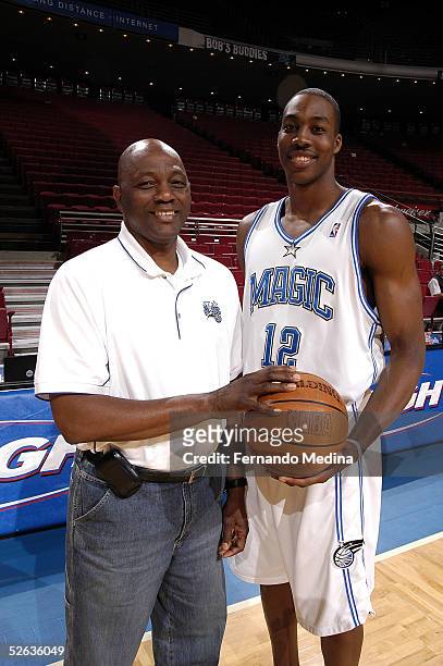 Dwight Howard Sr. Poses with son Dwight Howard#12 of the Orlando Magic before a game against the Atlanta Hawks March 28, 2005 at TD Waterhouse Centre...