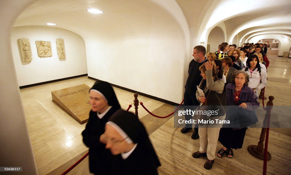 Visitors Tour Crypts Beneath Saint Peter's Basilica
