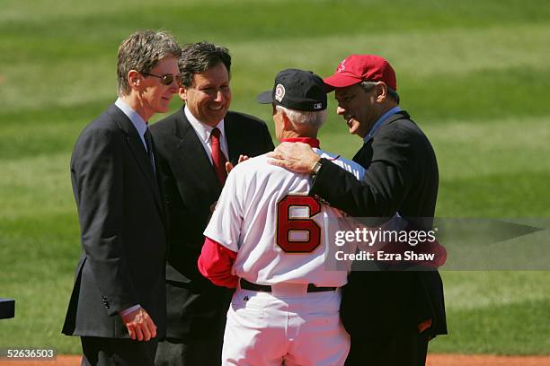 Boston Red Sox legend Johnny Pesky talks to Boston Red Sox principal owner John Henry, Red Sox vice chairman Tom Werner, and team president/CEO Larry...