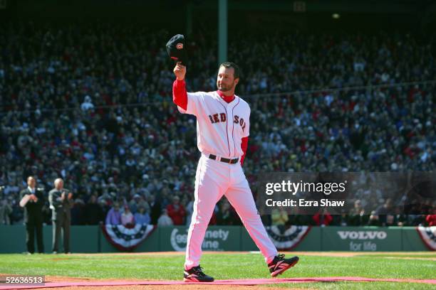 Pitcher Tim Wakefield of the Boston Red Sox waves to the fans during a pre-game ceremony celebrating the Red Sox win in the 2004 World Series. The...