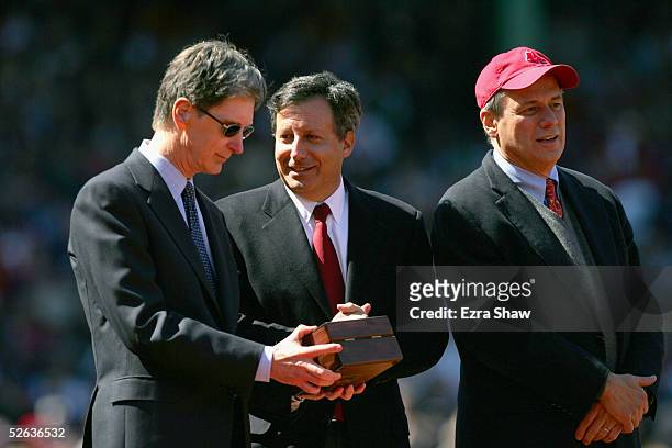 Boston Red Sox principal owner John Henry stands with Red Sox vice chairman Tom Werner, and team president/CEO Larry Lucchino during a pre-game...
