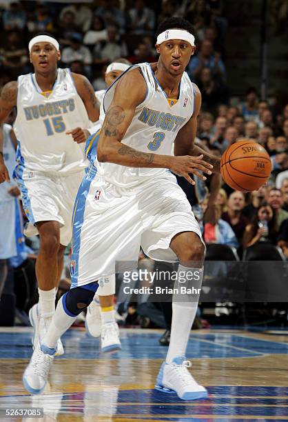 DerMarr Johnson of the Denver Nuggets takes the ball off a fast break against the Memphis Grizzlies in the first quarteron April 15, 2005 at the...