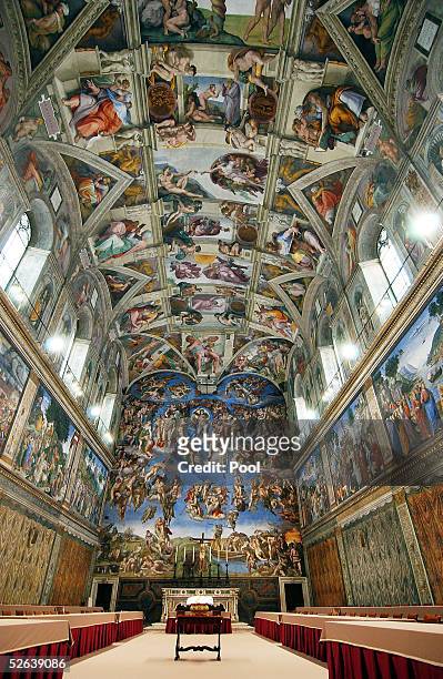 Tables and chairs are set in the Sistine Chapel where Conclave of Cardinals will be hosted to pick the next Pope April 16, 2005 in Vatican City. The...