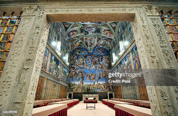 Tables and chairs are set in the Sistine Chapel where Conclave of Cardinals will be hosted to pick the next Pope April 16, 2005 in Vatican City. The...