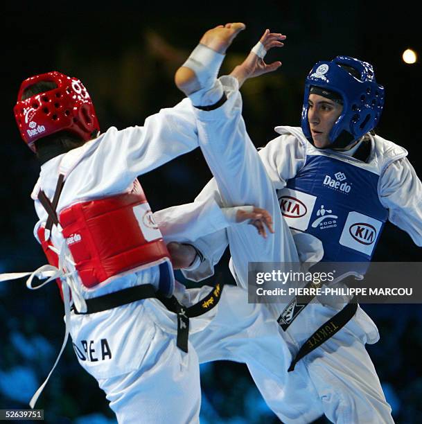 Korean Kim Bo-Hye avoids a high kick of Turkish Zeynep Murat during their women's under 55 kg final match at the Taekwondo World Championships in...