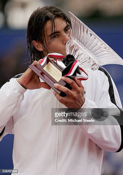 Rafael Nadal of Spain kisses the trophy after his victory in the final against Guillermo Coria of Argentina at the ATP Master Series at the Monte...