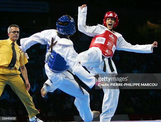 Diana Lopez of the US scores a point on Korean Kim Sae-Rom during their women's under 59 kg final match at the Taekwondo World Championships in...