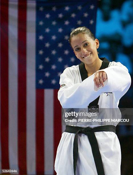 Diana Lopez of the US celebrates her gold medal on the women's under 59 kg final podium at the Taekwondo World Championships in Madrid, 17 April...