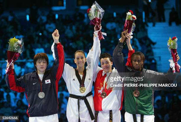 Gold medalist Diana Lopez of the US celebrates flanked by silver medalist Korean Kim Sae-Rom and bronze medalists Canadian Karine Sergerie and...