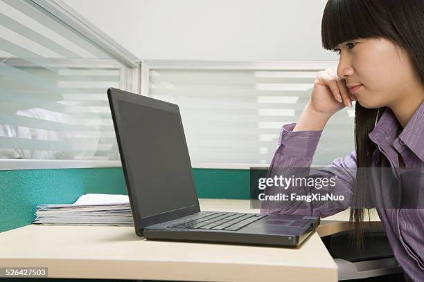 businesswoman using laptop in office - slow internet stock pictures, royalty-free photos & images