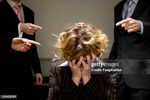 woman being accused in office - verwijten stockfoto's en -beelden