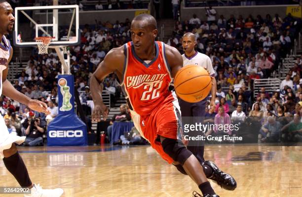 Brevin Knight of the Charlotte Bobcats drives to the hoop against the Washington Wizards on April 17, 2005 at the MCI Center in Washington, DC. The...