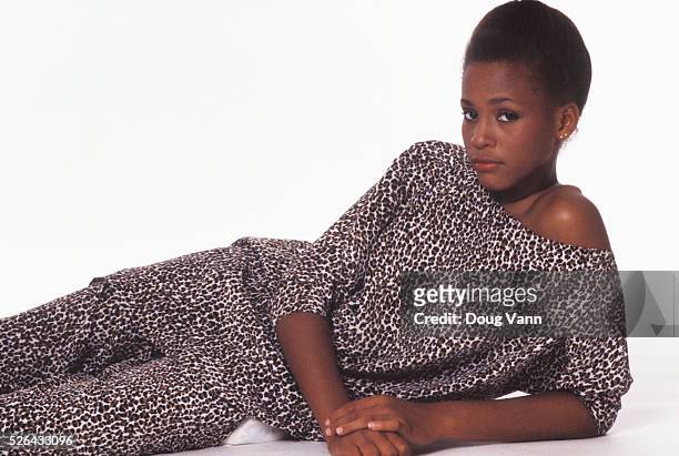 Young model Whitney Houston in a photography fashion session in New York City in September of 1980. Photo by Doug Vann. Silk Cheetah print dress by...