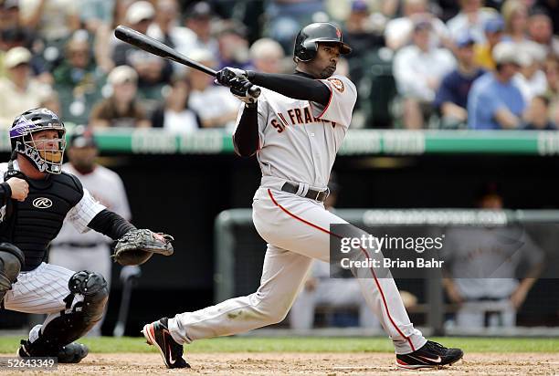 Michael Tucker of the San Francisco Giants hits an RBI double against the Colorado Rockies in the fourth inning at Coors Field on April 17, 2005 in...