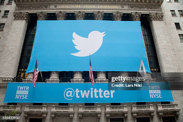 Twitter banner is displayed in front of the New York Stock Exchange during Twitter Inc.'s initial public offering on the floor of the New York Stock...