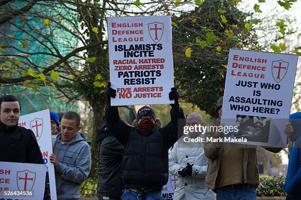 English Defence League supporters gather in support of leader Tommy Robinson, also known as Stephen Lennon, outside the West London Magistrates...