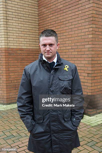 English Defence League leader Tommy Robinson, also known as Stephen Lennon, poses for a portrait outside the West London Magistrates court, in...